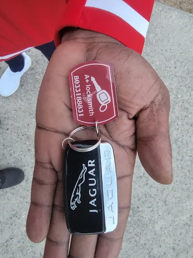 A Plus Locksmith — Jaguar smart key made on-site, with our A Plus Locksmith LLC tag