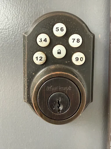 A Plus Locksmith — electronic keypad deadbolt installed on a customer's door